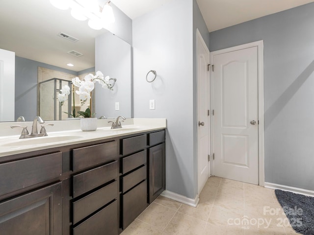 9123 Magnolia Lily Ave, Charlotte, NC 28227 - full bath with double vanity, tile patterned floors, and an enclosed shower
