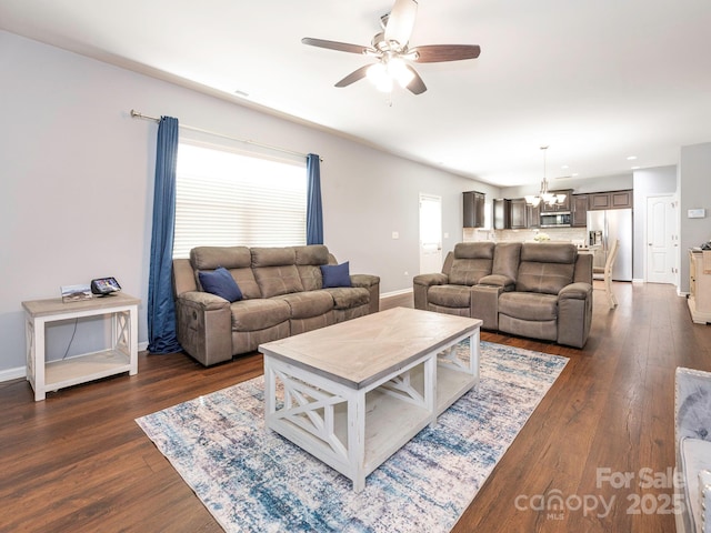 9123 Magnolia Lily Ave, Charlotte, NC 28227 - living area with ceiling fan, a chandelier, and dark wood finished floors