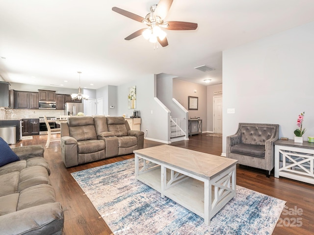 9123 Magnolia Lily Ave, Charlotte, NC 28227 - living room with dark wood-type flooring, a ceiling fan, stairway, a chandelier, and recessed lighting