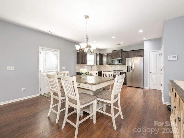 9123 Magnolia Lily Ave, Charlotte, NC 28227 - dining space with a chandelier, recessed lighting, and dark wood finished floors