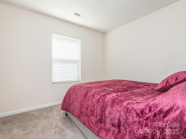 9123 Magnolia Lily Ave, Charlotte, NC 28227 - bedroom with light carpet and baseboards