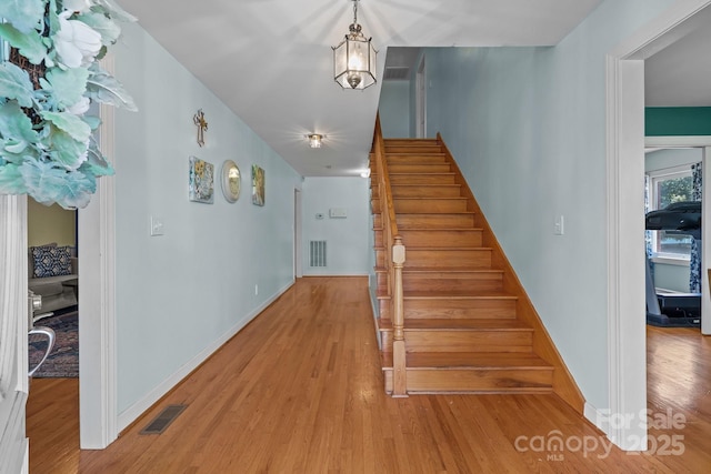 114 Windchime Ln, Mooresville, NC 28115 - stairway with wood finished floors and baseboards