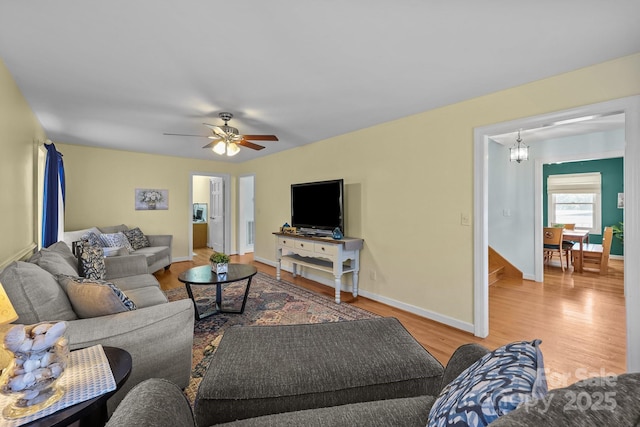 114 Windchime Ln, Mooresville, NC 28115 - living room featuring wood finished floors, ceiling fan, and a chandelier