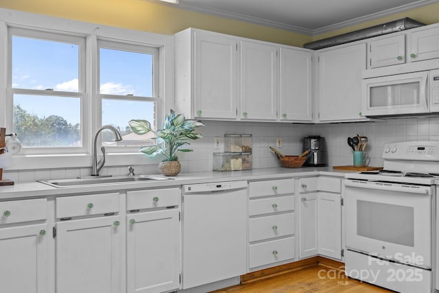 114 Windchime Ln, Mooresville, NC 28115 - kitchen with white appliances, ornamental molding, light countertops, backsplash, and white cabinetry