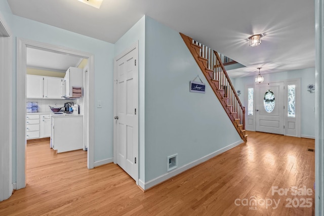 114 Windchime Ln, Mooresville, NC 28115 - foyer entrance featuring stairs and light wood-style flooring