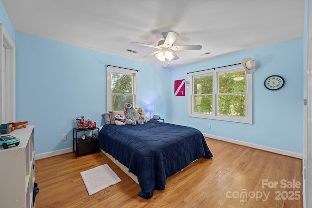 114 Windchime Ln, Mooresville, NC 28115 - bedroom with light wood-type flooring and a ceiling fan