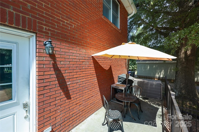 114 Windchime Ln, Mooresville, NC 28115 - view of home's exterior with brick siding and a patio