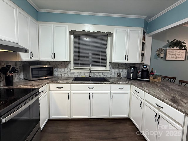 605 Impala Dr, Albemarle, NC 28001 - kitchen with stainless steel microwave, electric range oven, white cabinetry, dark wood-style flooring, and crown molding