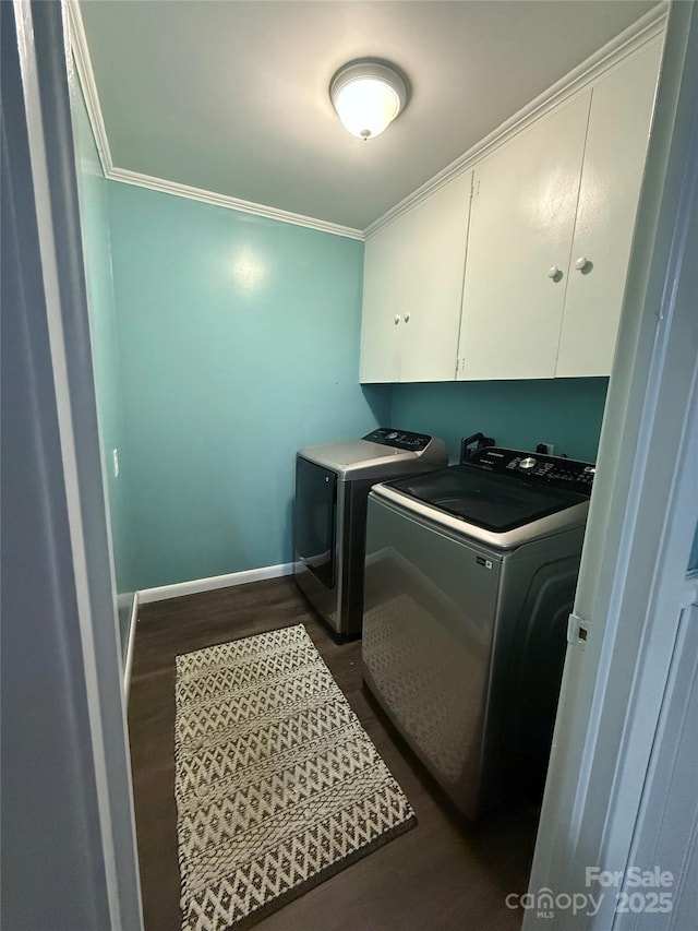 605 Impala Dr, Albemarle, NC 28001 - washroom with cabinet space, washer and dryer, ornamental molding, and dark wood finished floors