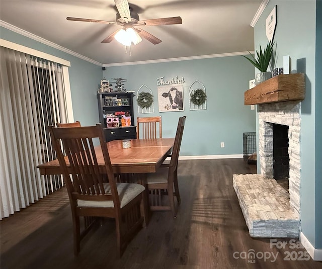 605 Impala Dr, Albemarle, NC 28001 - dining space featuring dark wood-style flooring, ceiling fan, crown molding, and a stone fireplace