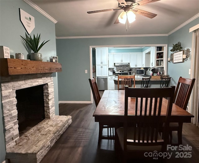 605 Impala Dr, Albemarle, NC 28001 - dining space with ceiling fan, ornamental molding, dark wood-style floors, and a stone fireplace
