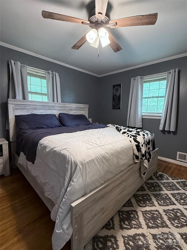 605 Impala Dr, Albemarle, NC 28001 - bedroom featuring dark wood-style floors, multiple windows, ornamental molding, and ceiling fan