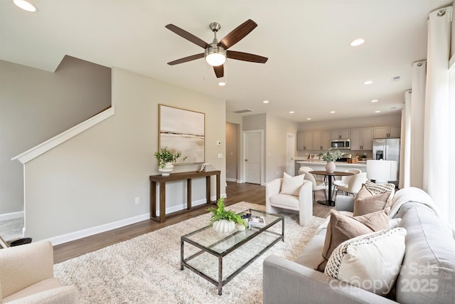8036 Joy Crossing Ln, Charlotte, NC 28214 - living area with ceiling fan, wood finished floors, recessed lighting, and stairs