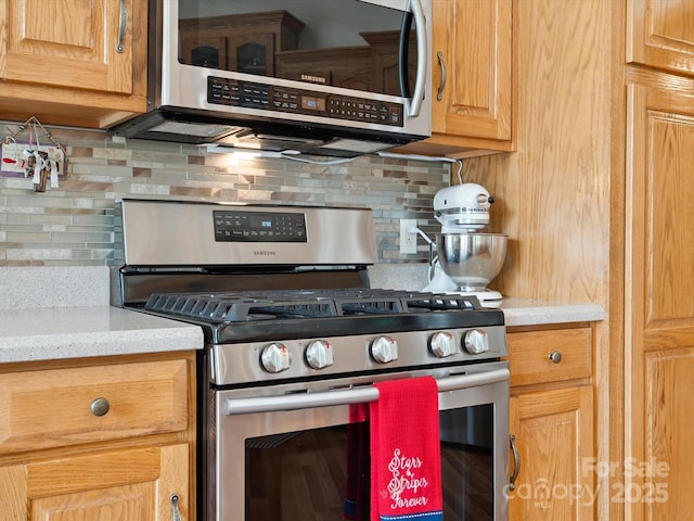 887 Living Waters Dr, Great Falls, SC 29055 - kitchen with appliances with stainless steel finishes and tasteful backsplash