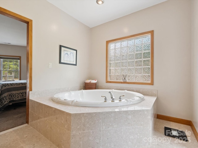 887 Living Waters Dr, Great Falls, SC 29055 - bathroom featuring a bath, ensuite bath, and tile patterned floors