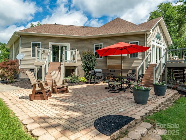887 Living Waters Dr, Great Falls, SC 29055 - back of house with stairs, a wooden deck, and a patio