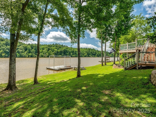 887 Living Waters Dr, Great Falls, SC 29055 - view of grassy yard with a boat dock, a water view, a forest view, and stairway