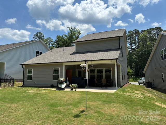 284 Old Harbor Dr, Mount Gilead, NC 27306 - rear view of property with a patio area, a yard, and a shingled roof