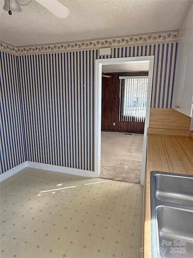 3412 1st Avenue Cir NW, Hickory, NC 28601 - empty room with a textured ceiling and wallpapered walls
