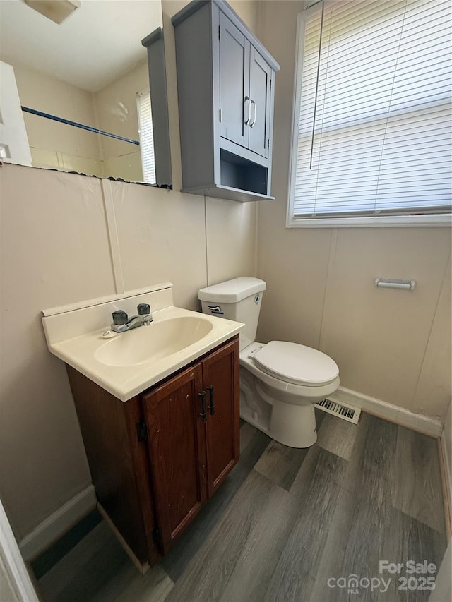 3412 1st Avenue Cir NW, Hickory, NC 28601 - bathroom featuring wood finished floors, vanity, plenty of natural light, and a shower