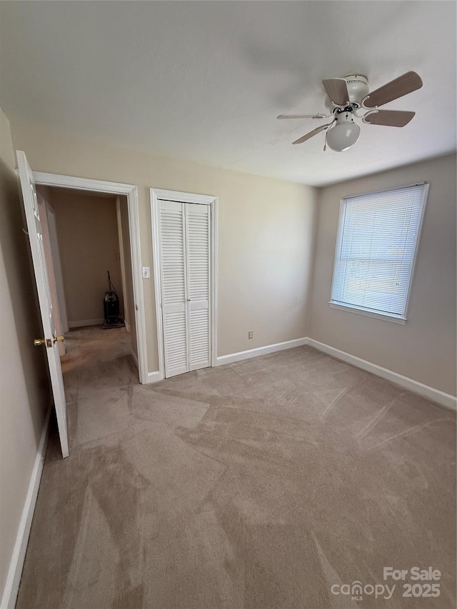 3412 1st Avenue Cir NW, Hickory, NC 28601 - unfurnished bedroom with carpet, a closet, and a ceiling fan
