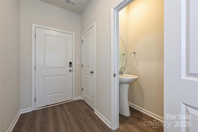 1434 31st St NE, Conover, NC 28613 - corridor with dark wood-type flooring and baseboards