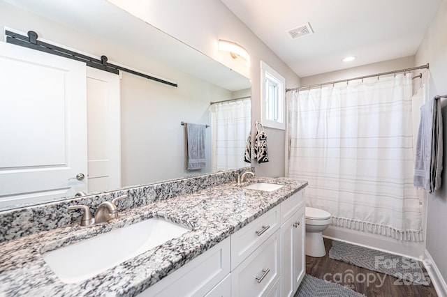 2526 Snow Creek Rd NE, Hickory, NC 28601 - full bathroom with double vanity, wood finished floors, curtained shower, and recessed lighting