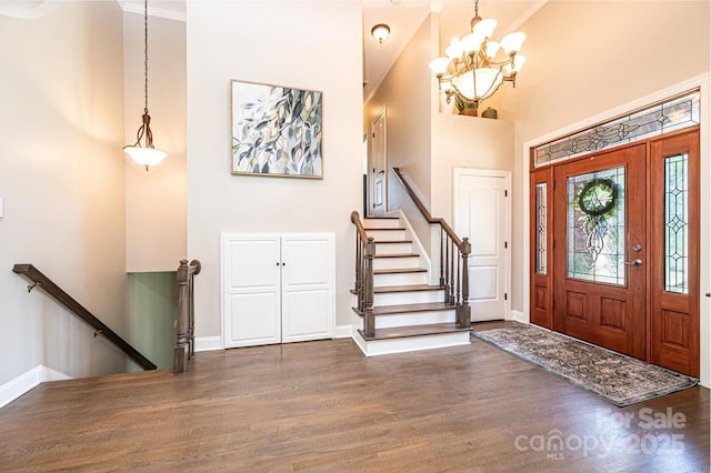 1083 Fox Chase Dr, Newton, NC 28658 - foyer with wood finished floors, a chandelier, a towering ceiling, and crown molding