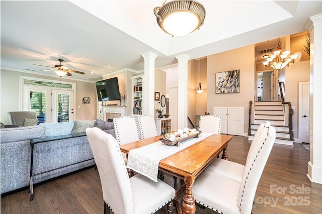 1083 Fox Chase Dr, Newton, NC 28658 - dining room with decorative columns, wood finished floors, ornamental molding, ceiling fan, and a chandelier