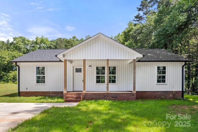 1234 Goodnight Ln, Kannapolis, NC 28081 - modern inspired farmhouse featuring a shingled roof, a front yard, a porch, crawl space, and board and batten siding