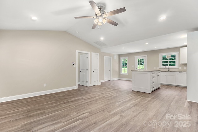 1234 Goodnight Ln, Kannapolis, NC 28081 - kitchen featuring a ceiling fan, white cabinetry, light wood finished floors, a center island, and recessed lighting
