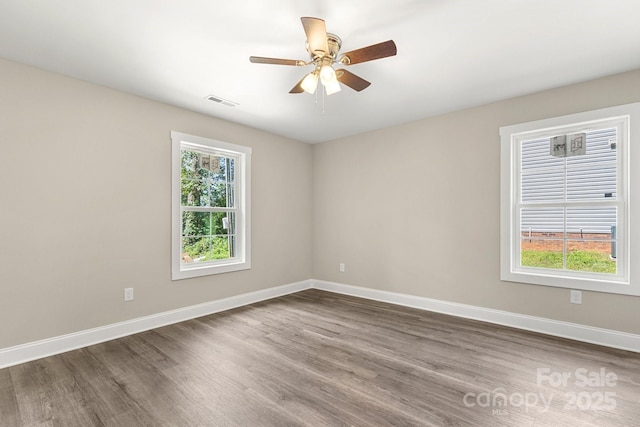 1234 Goodnight Ln, Kannapolis, NC 28081 - empty room featuring dark wood-type flooring and ceiling fan