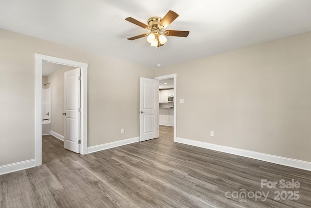 1234 Goodnight Ln, Kannapolis, NC 28081 - unfurnished bedroom featuring wood finished floors and a ceiling fan