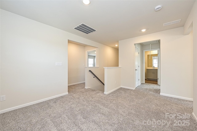 1402 31st St NE, Conover, NC 28613 - carpeted empty room with a smoke detector, recessed lighting, plenty of natural light, and attic access