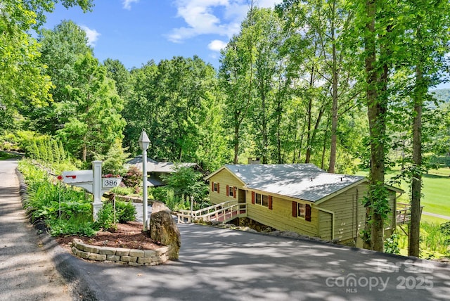 386 Country Club Dr Unit C6, Canton, NC 28716 - view of front of home featuring a chimney and a forest view