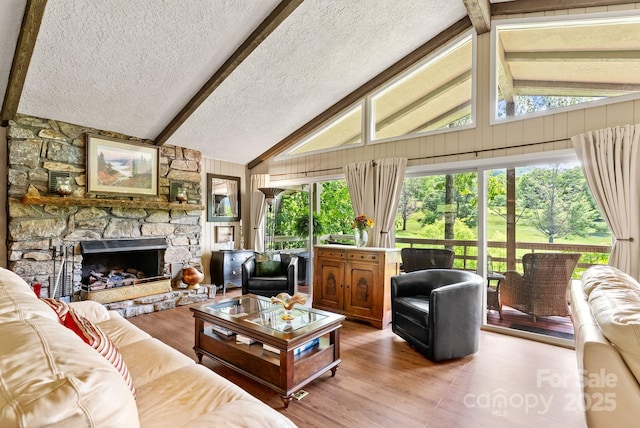 386 Country Club Dr Unit C6, Canton, NC 28716 - living room featuring light wood-style flooring, a textured ceiling, and a fireplace