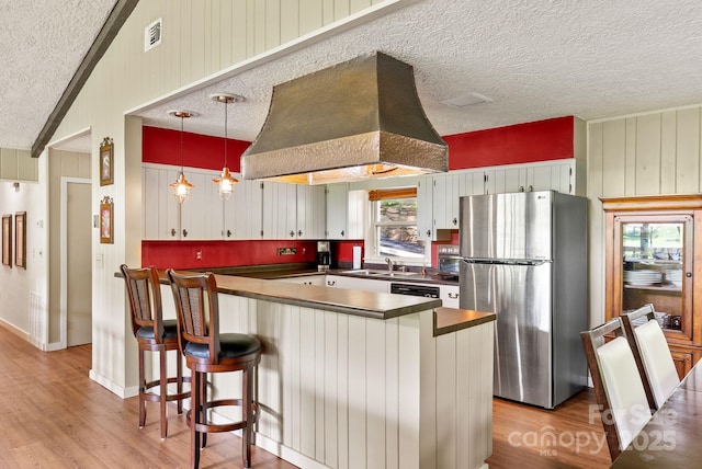 386 Country Club Dr Unit C6, Canton, NC 28716 - kitchen featuring freestanding refrigerator, dark countertops, custom exhaust hood, a textured ceiling, and light wood finished floors