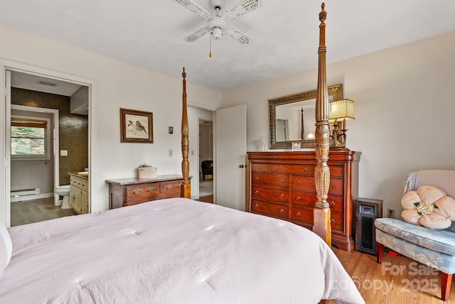 386 Country Club Dr Unit C6, Canton, NC 28716 - bedroom featuring wood finished floors, a baseboard radiator, ensuite bath, and a ceiling fan