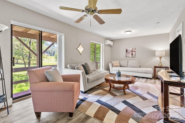 386 Country Club Dr Unit C6, Canton, NC 28716 - living room featuring an AC wall unit, light wood-style flooring, and ceiling fan