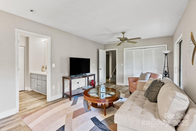 386 Country Club Dr Unit C6, Canton, NC 28716 - living room with light wood-type flooring, ceiling fan, and stairs