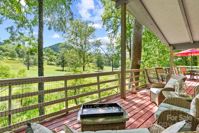 386 Country Club Dr Unit C6, Canton, NC 28716 - wooden deck featuring outdoor dining area, view of scattered trees, and a mountain view