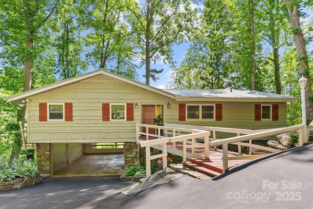 386 Country Club Dr Unit C6, Canton, NC 28716 - view of front of home with a carport, asphalt driveway, a metal roof, and stone siding