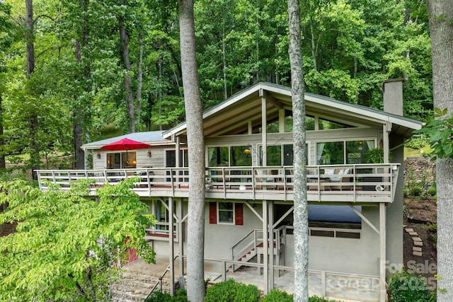 386 Country Club Dr Unit C6, Canton, NC 28716 - back of house featuring stairway, a chimney, stucco siding, a patio area, and a wooden deck