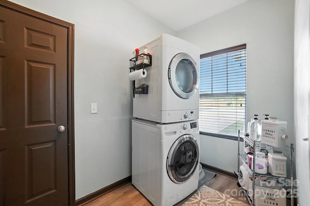 8152 Chilkoot Ln, Locust, NC 28097 - laundry room with estacked washer and dryer and light wood finished floors