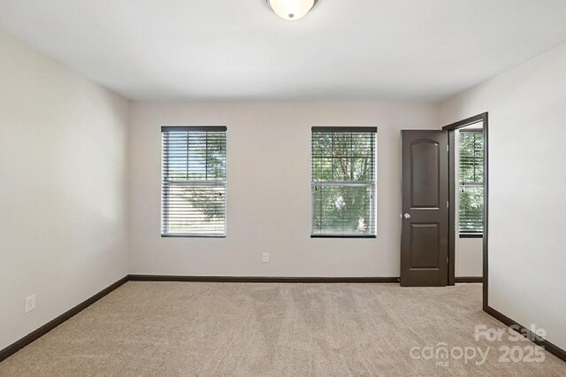 8152 Chilkoot Ln, Locust, NC 28097 - spare room with light carpet and baseboards
