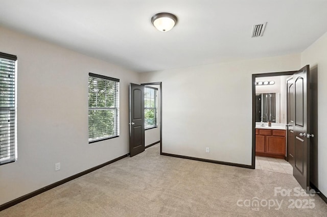 8152 Chilkoot Ln, Locust, NC 28097 - unfurnished bedroom with light carpet and ensuite bathroom