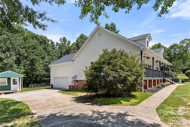 814 Carved Oak Ct, York, SC 29745 - view of home's exterior with covered porch, driveway, an outdoor structure, stairs, and an attached garage