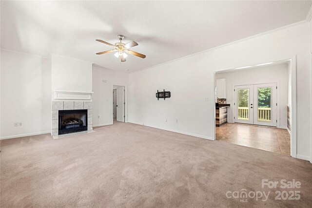 814 Carved Oak Ct, York, SC 29745 - unfurnished living room with ceiling fan, carpet flooring, a fireplace, crown molding, and french doors