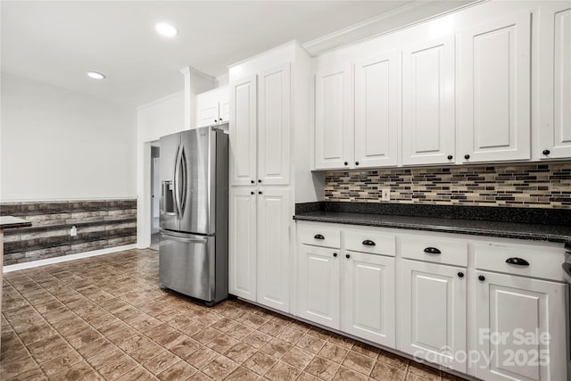 814 Carved Oak Ct, York, SC 29745 - kitchen featuring stainless steel refrigerator with ice dispenser, dark countertops, white cabinets, tasteful backsplash, and recessed lighting