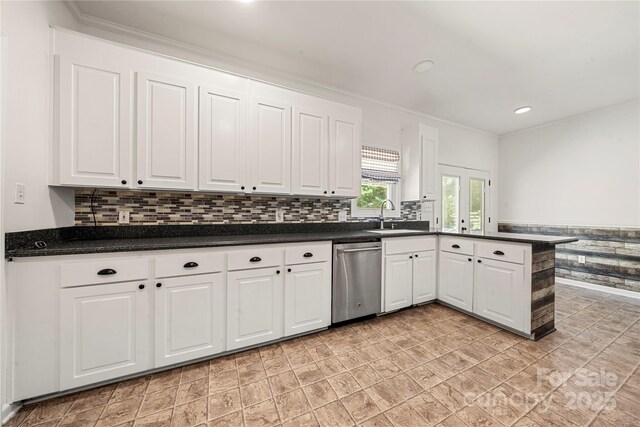 814 Carved Oak Ct, York, SC 29745 - kitchen with dishwasher, white cabinetry, dark countertops, a peninsula, and crown molding